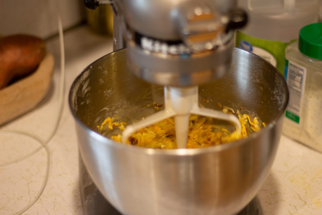 breakfast quiche ingredients mixing in kitchen aid mixer on counter in kitchen