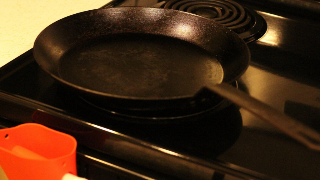 clean cast iron skillet on stove
