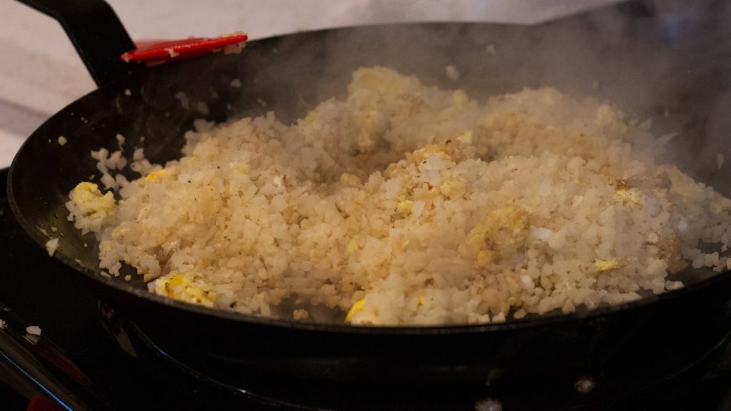 cauliflower rice recipe in a pan on stove